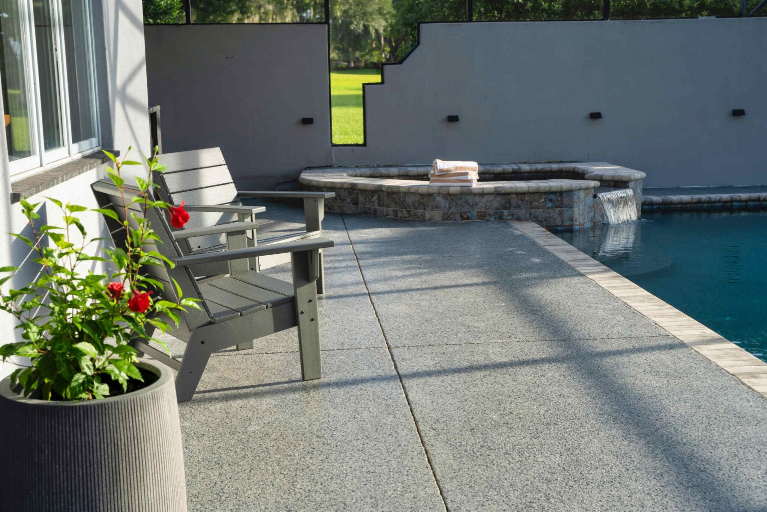 Patio With Patio Chairs Next To The Pool - Luxoria Recovery