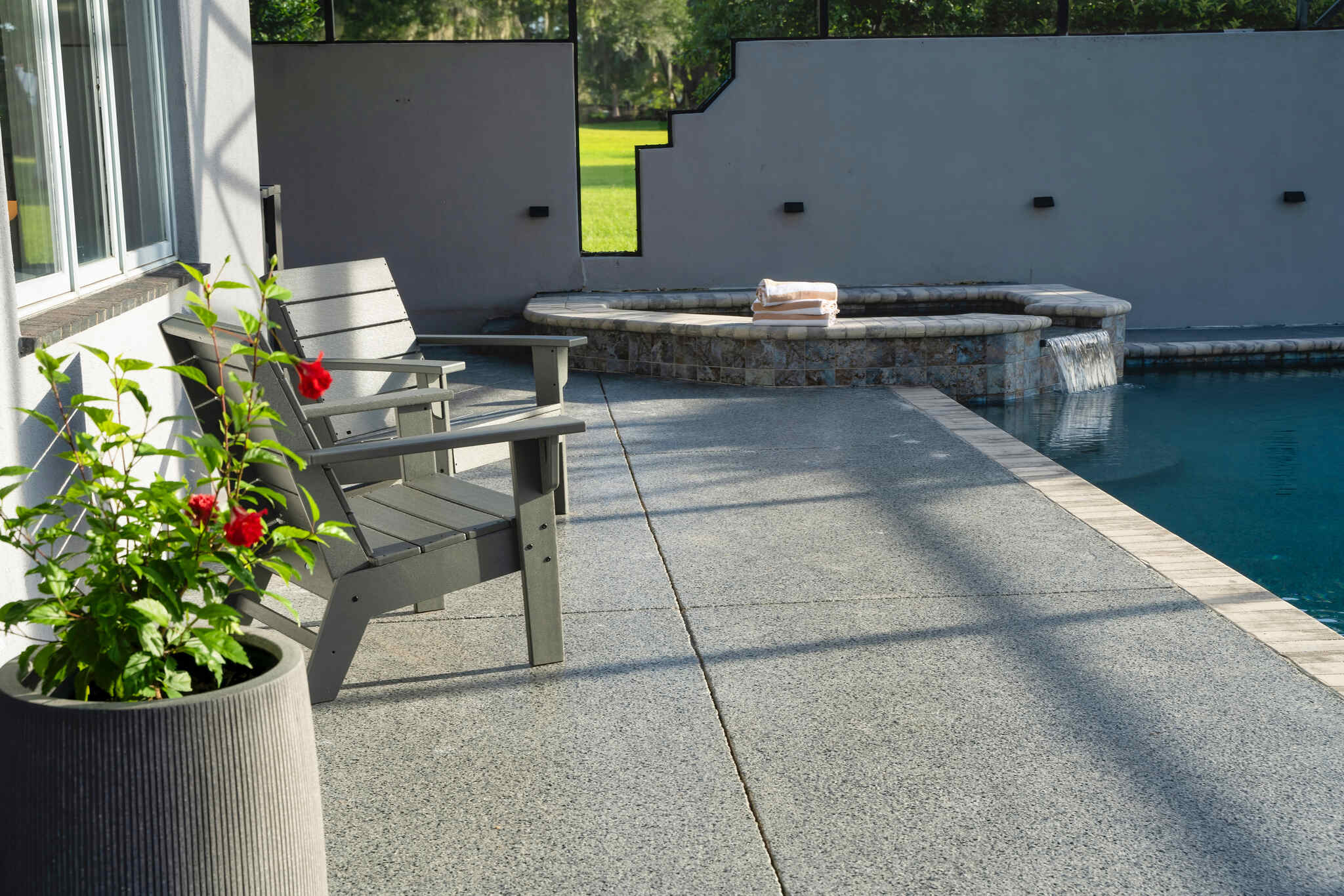 Patio With Patio Chairs Next To The Pool - Luxoria Recovery